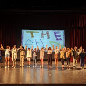 A group of kids take a bow at the end of their performance during Kids Do It All summer music-theatre camp at CSU