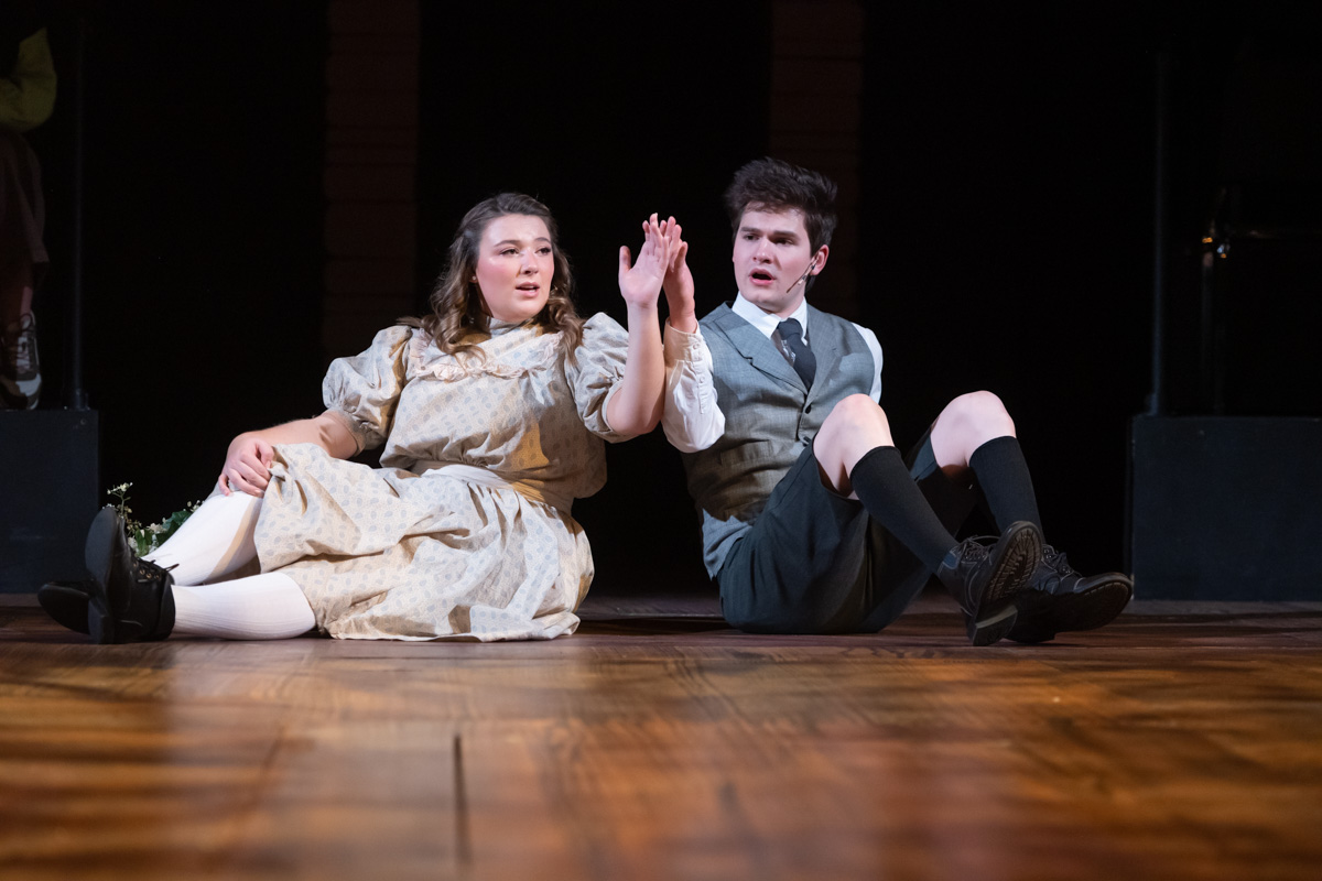 2022 Spring Awakening Promotional Photo Girl and Boy touch back of hands