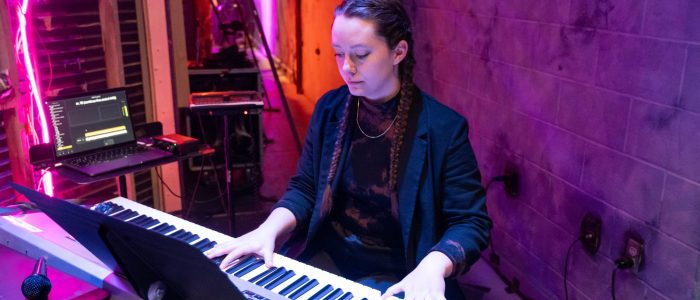 Hannah Swanson playing keyboard